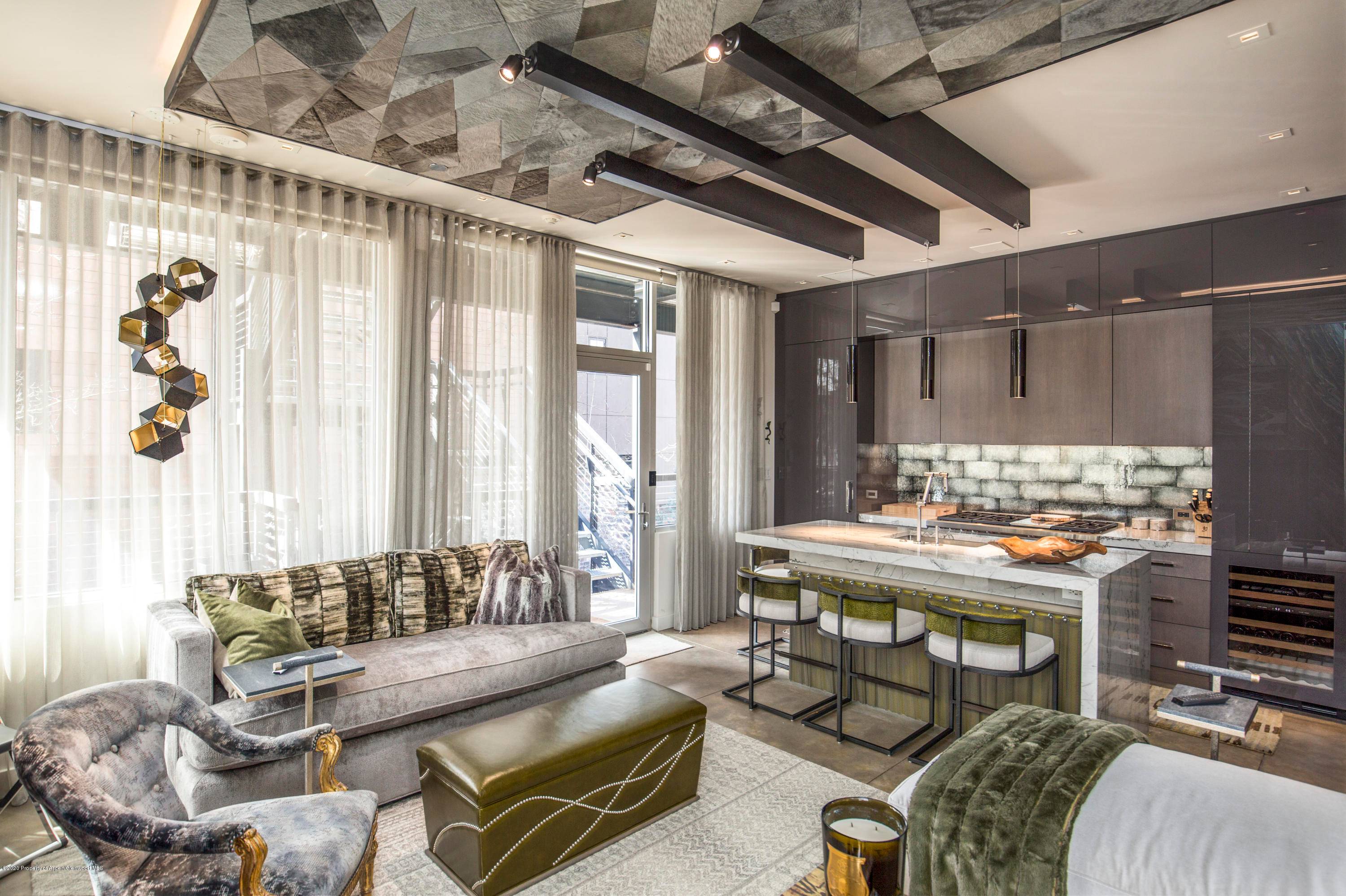Luxurious entertaining areas and intimate family retreats blend seamlessly in this stunning Aspen condo.