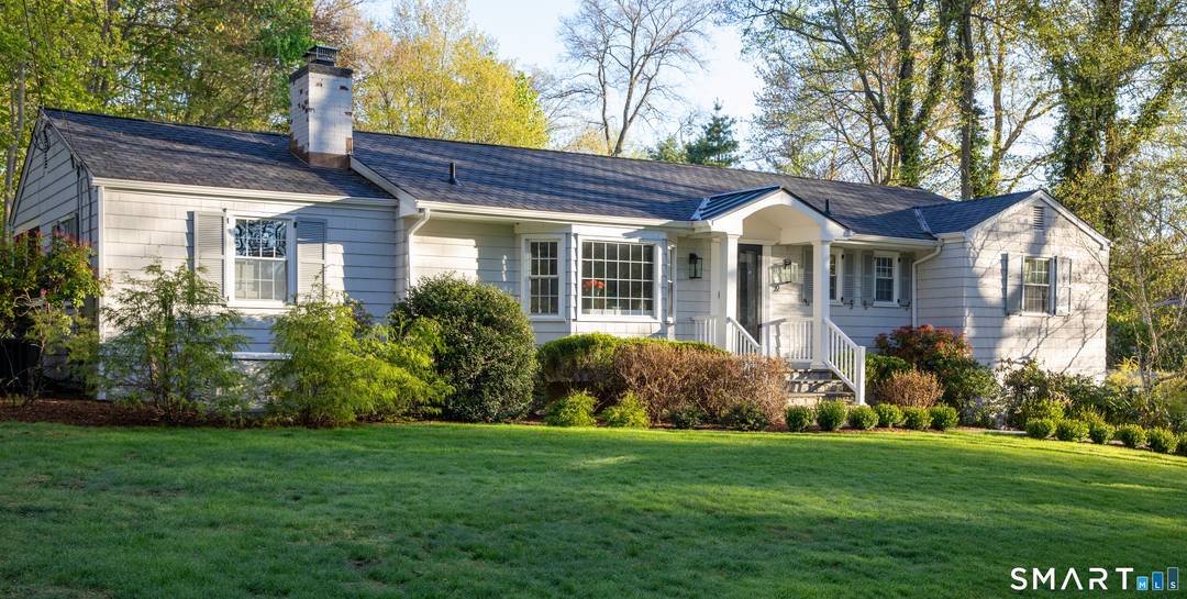 Tucked away on a peaceful one acre property, this charming summer retreat offers privacy and comfort in a serene setting.