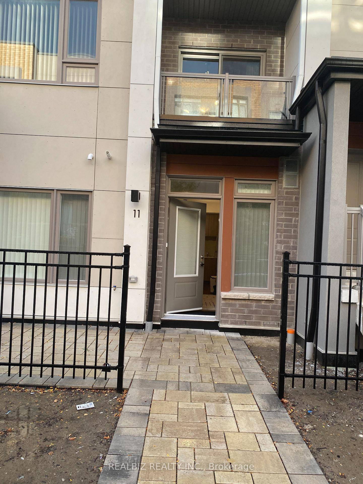 Tastefully Furnished model unit 1Br 1WR Townhome S S Fridge, S S Dishwasher, S S Stove With Hood Ensuite Laundry Private Patio Laminate Flooring In Living Room Kitchen.