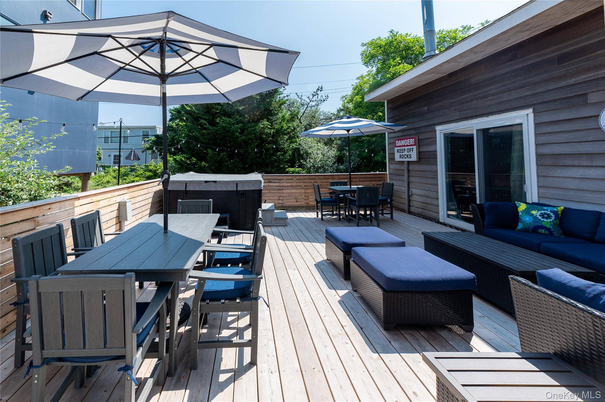 Come see this beautifully renovated 3 bedroom, 2 bath beach home with loft, outdoor shower and hot tub !