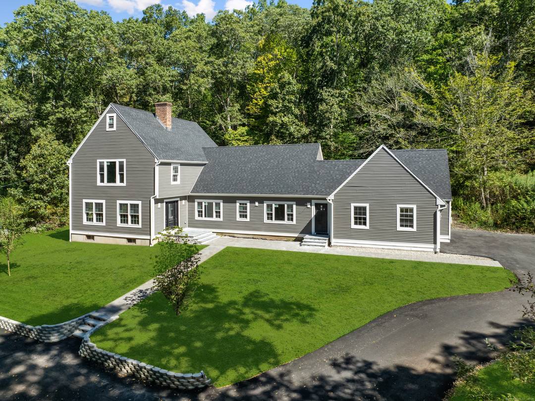 Nestled along a peaceful country road, this stunning 5 bedroom, 4 bath Colonial offers over 4, 600 square feet of living space with hardwood floors throughout and beautifully tiled bathrooms.