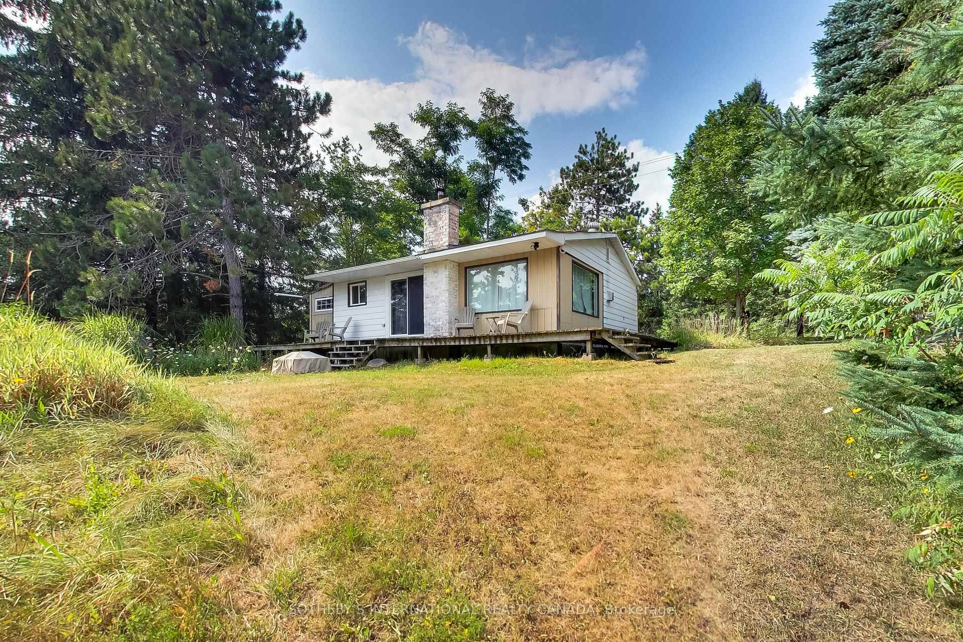 Discover a rare double lot 200ft x 150ft property situated on top of Mulmurs scenic hills.