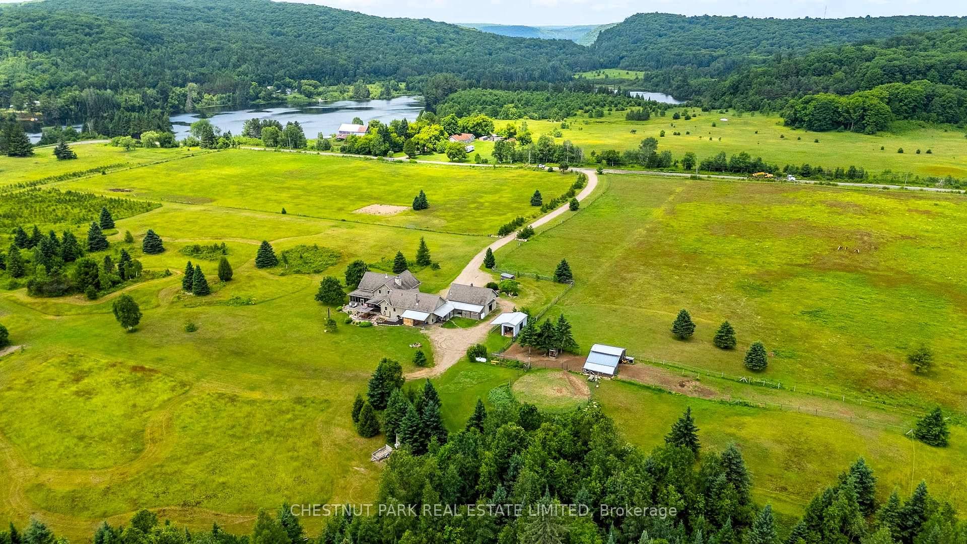 An extraordinary country estate set on 122 acres of rolling pasture, hardwood forest, and scenic trails.