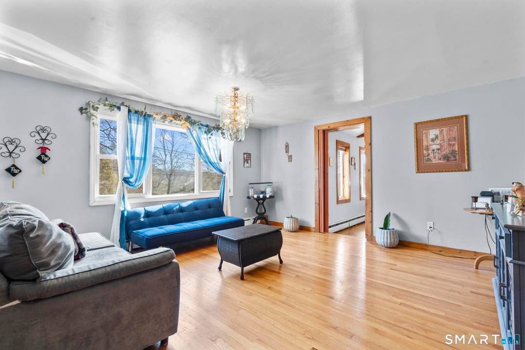 Charming 3 bedroom and 2 full bath ranch style home with a spacious backyard and a huge deck on 1.