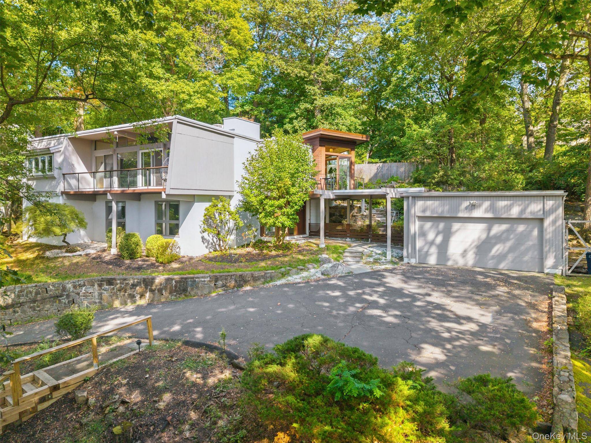 Welcome to your mid century modern oasis with sweeping Hudson River views.