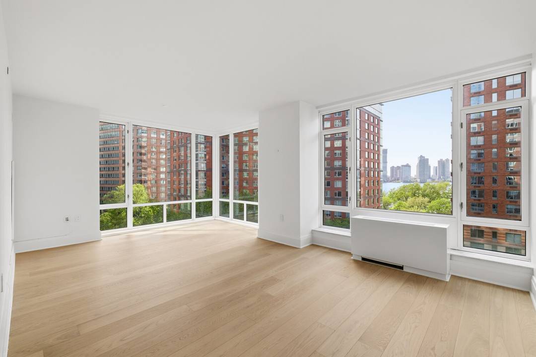 Live in this stunning corner 1260sf 2 bedroom Corner Unit at Tribeca Green with River Views !