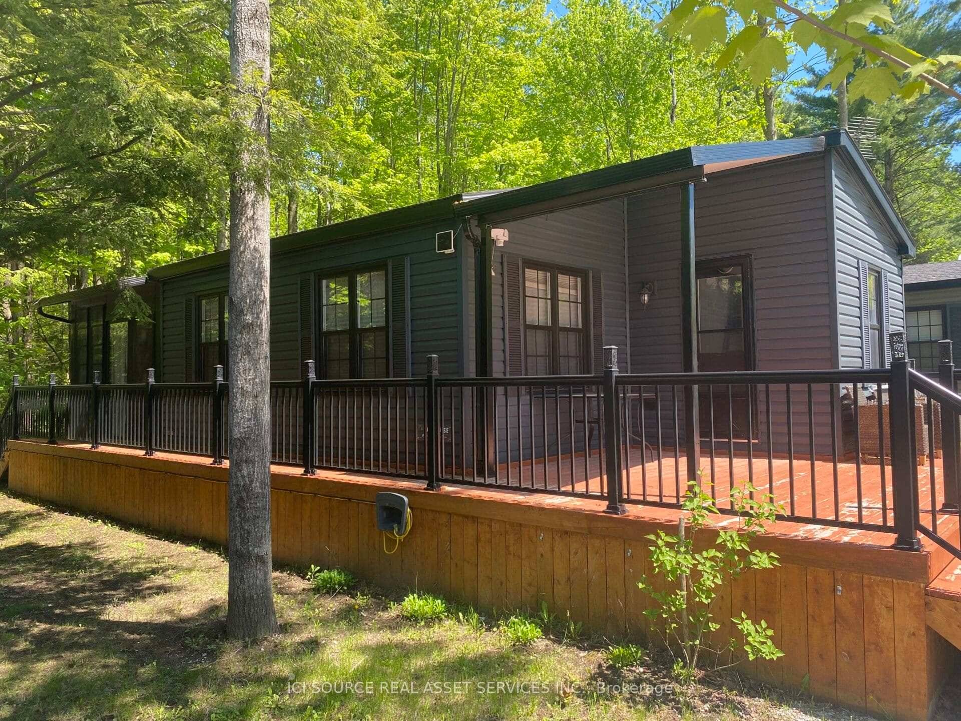 Nestled in a quiet, mature wooded area, this serene property offers exceptional privacy and natural beauty.