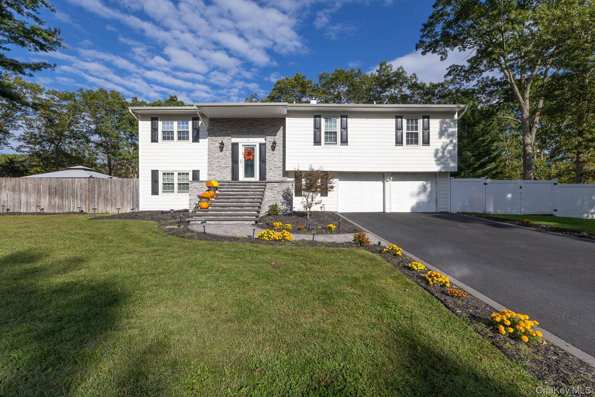 Gorgeous Updated 4 Bedroom, 3 Bath Hi Ranch in Miller Place School District Set on a Spacious 0.