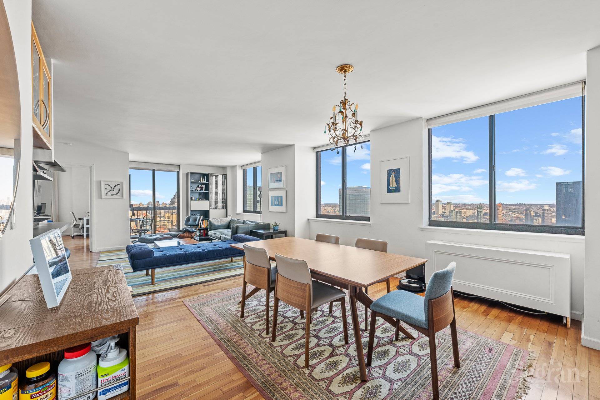 Sprawling Sun Flooded High Floor Condo with 2 Balconies and Spectacular Skyline and River Views.