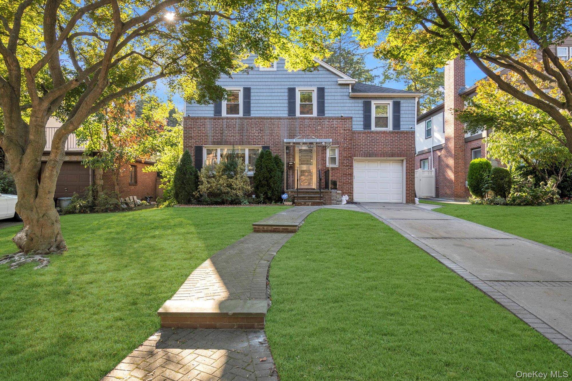 Maticulously updated brick colonial in the highly sought after Hollis Hills neighborhood.