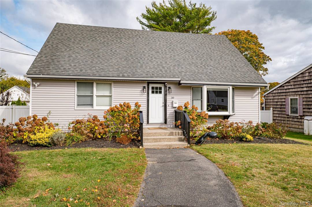 Beautifully renovated 4 bedroom, 2 bath Cape in the heart of Riverhead !