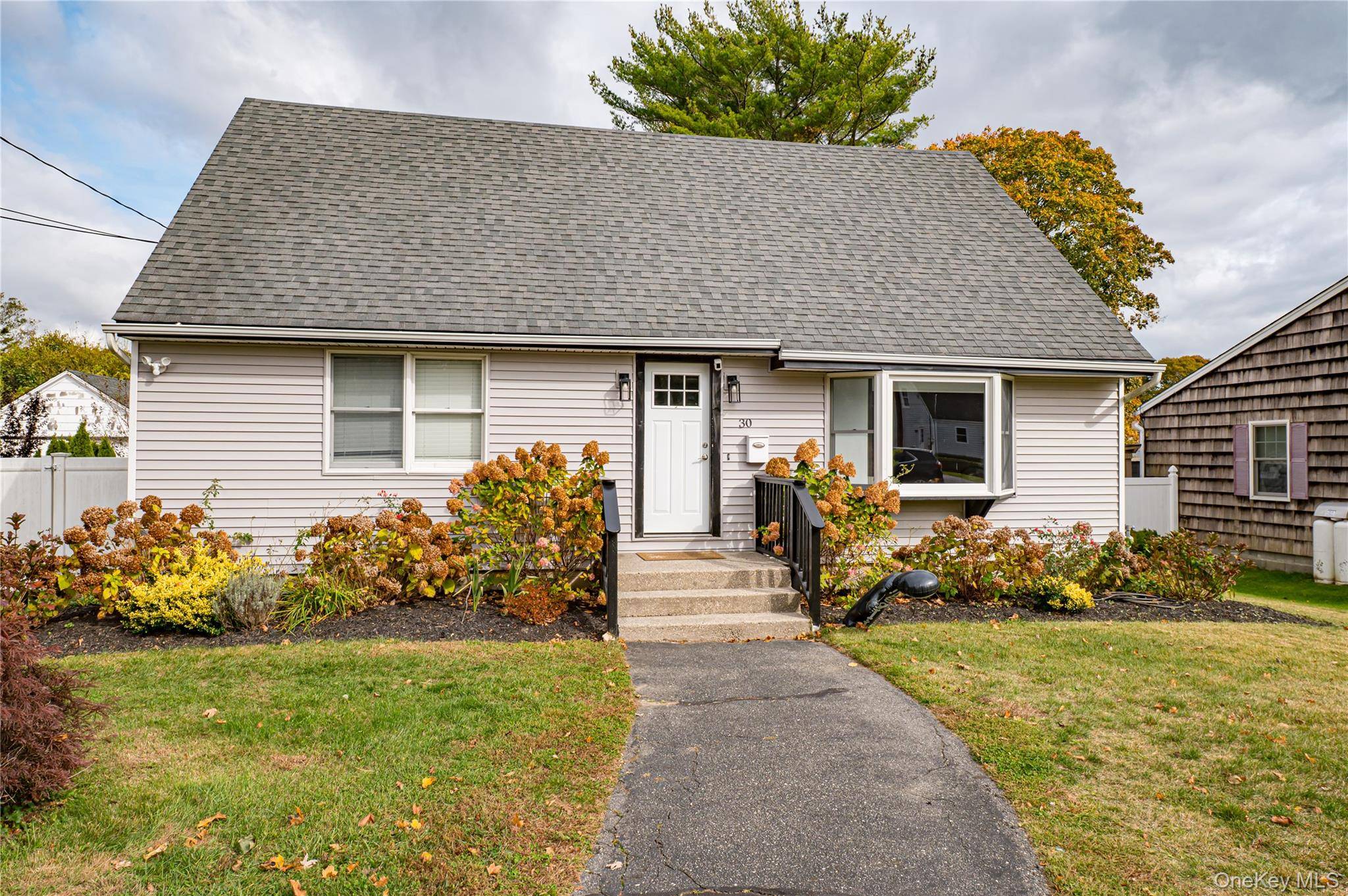 Beautifully renovated 4 bedroom, 2 bath Cape in the heart of Riverhead !
