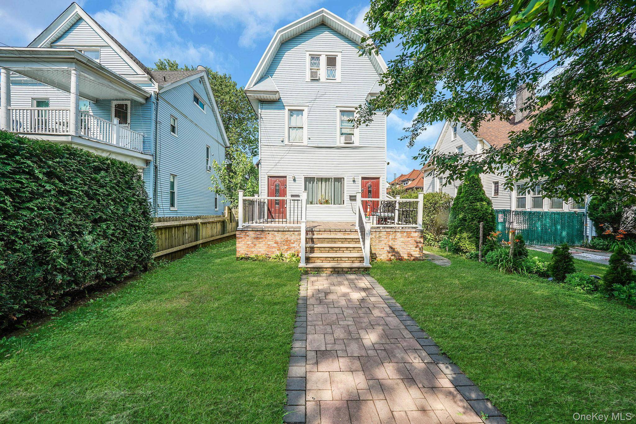Discover a rare opportunity to own a fully legal 3 family home in the heart of Richmond Hill, perfectly positioned for both comfortable living and strong rental income.