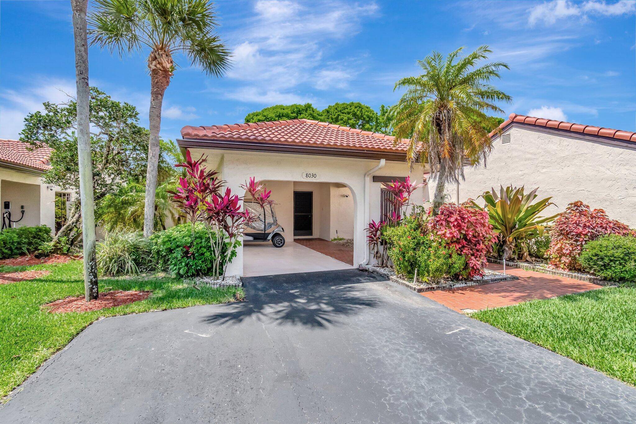 Welcome to this beautifully maintained and thoughtfully updated 2BR 2BA Villa in The Greens of Boca Lago !