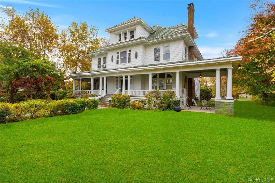 Step into the timeless grandeur of Wisteria Court, one of South Jamesport's most admired historic estates.