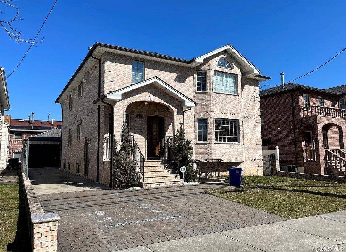Welcome home to this incredibly spacious first floor and basement of this brick 2 family house.
