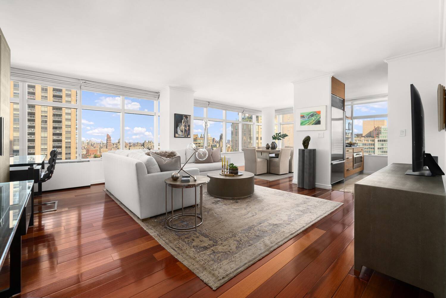 Step into this high floor, one bedroom with timeless finishes, thoughtful upgrades, and sweeping views west to the Hudson, north over the skyline, and east toward Central Park.