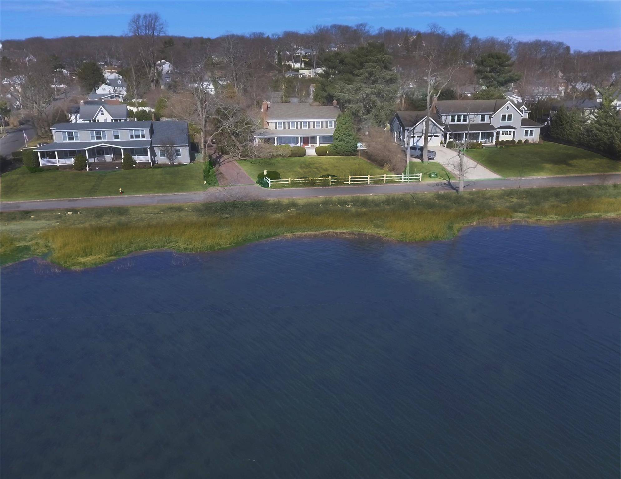 Waterfront Colonial Retreat Discover timeless charm in this lovely historic colonial nestled along Bayville s serene waterfront.