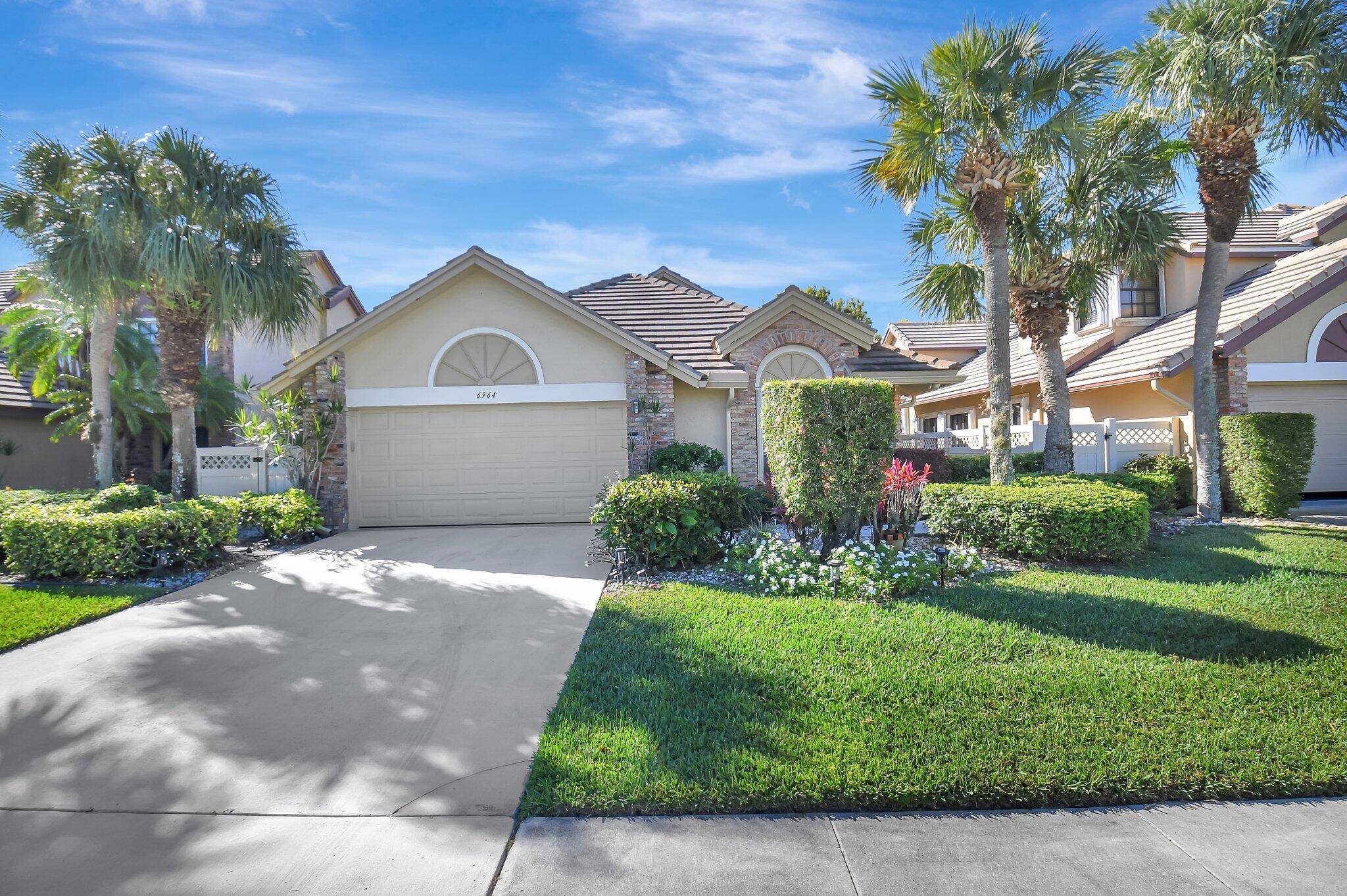This beautiful home in the all ages Cambridge section of Aberdeen Country Club offers lots of light stunning lake views.