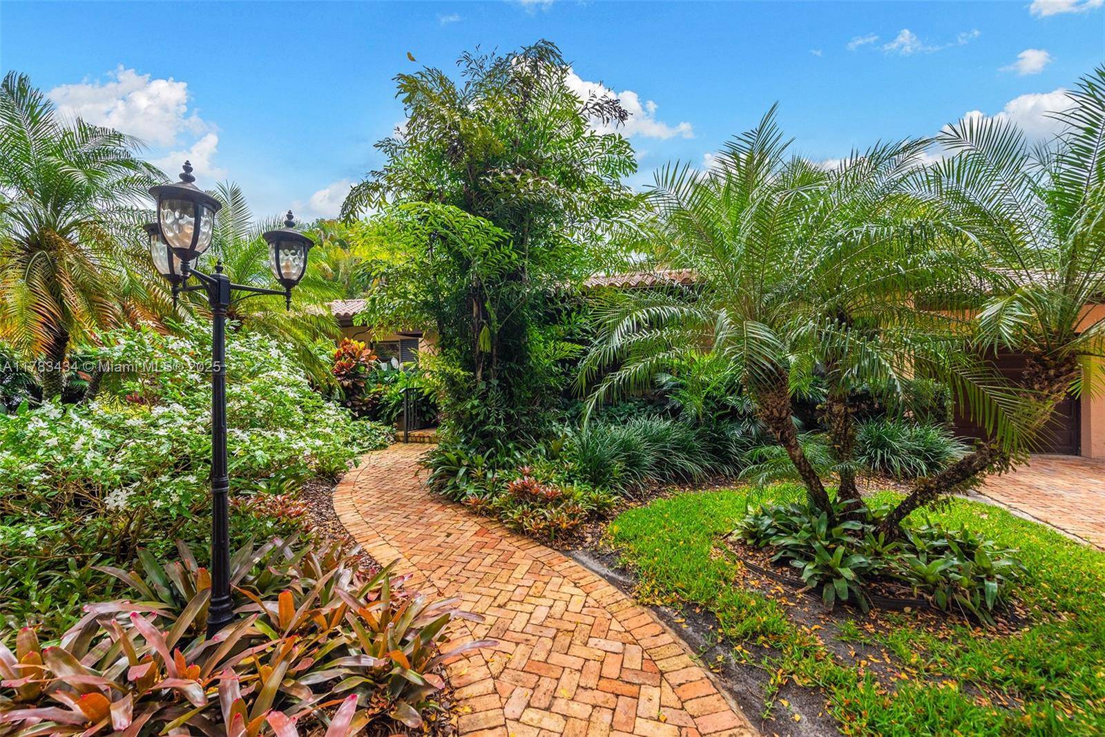 Tucked away on a lush lot in the coveted Platinum Triangle, this meticulously maintained tropical oasis brims w warmth, character amp ; potential.