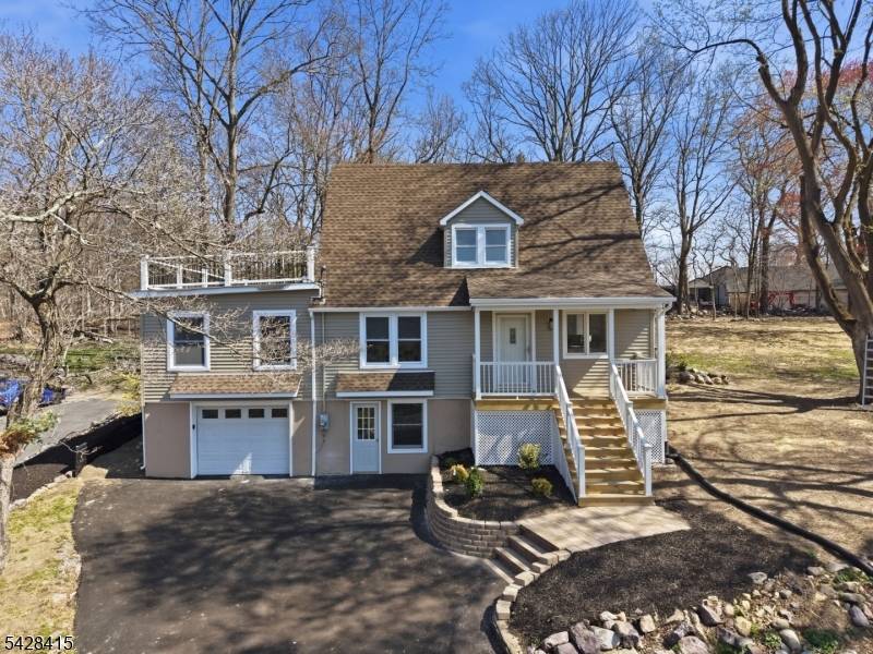Set on a scenic, elevated lot, this expanded home offers a unique blend of character, functionality, and outdoor living.