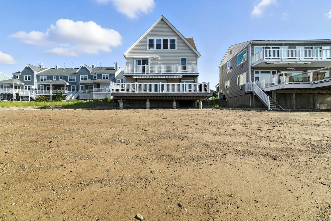 Spend your summer soaking up the sun at this exceptional, fully furnished waterfront retreat located on one of Cosey Beach Ave's most sought after sandy lots.