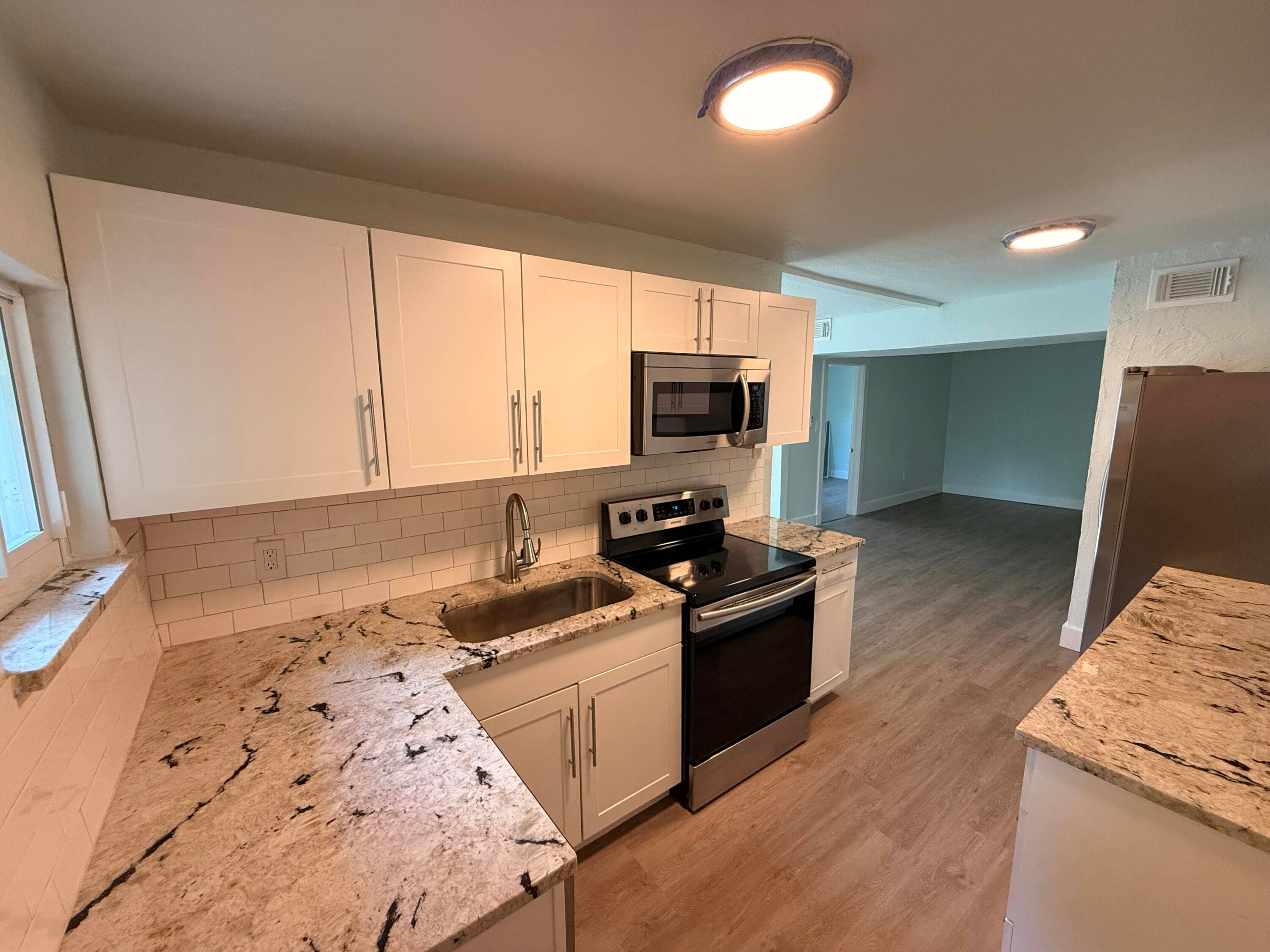 CHARMING OLD SPANISH STYLE DUPLEX IN COLONIAL ESTATES, JUST A SHORT DRIVE FROM DOWN TOWN WEST PALM BEACH AND PALM BEACH ISLAND.