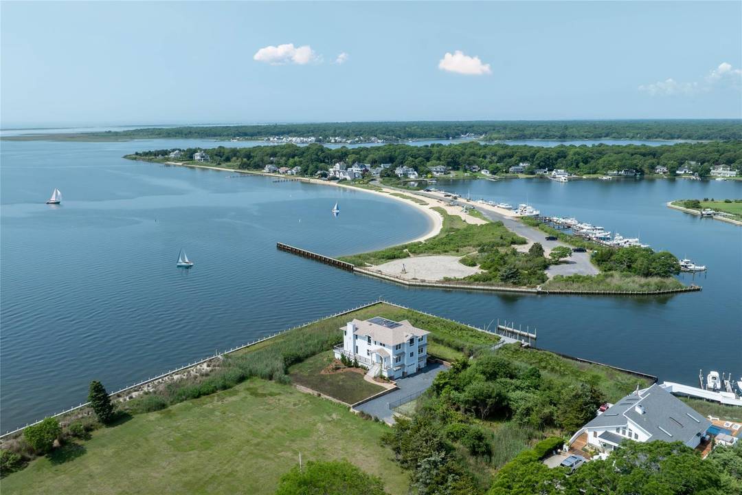 Extraordinary Waterfront Estate in Center Moriches Introducing a rare and remarkable offering on the serene shores of Senix Creek and the Great South Bay an exceptional waterfront residence boasting panoramic ...
