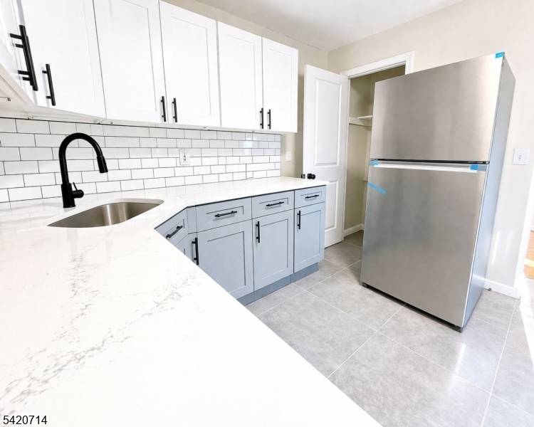 Spacious single family home featuring 5 bedrooms and 3 full bathrooms, offering a versatile mother daughter style layout with a kitchenette and flexible living arrangements.