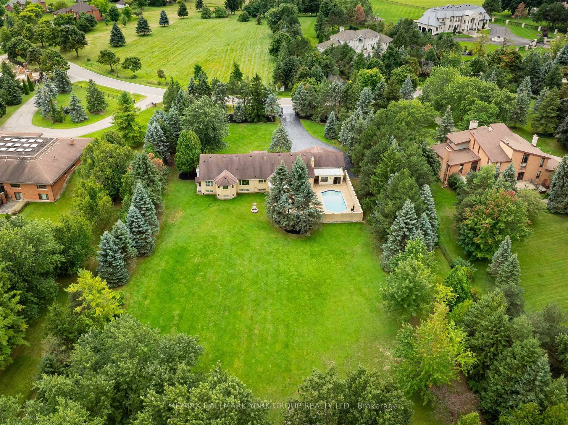 Welcome to one of the most breathtaking lots in all of prestigious Castlemore over 2 1 2 stunning acres of ultimate privacy in the quiet heart of this incredible neighbourhood.