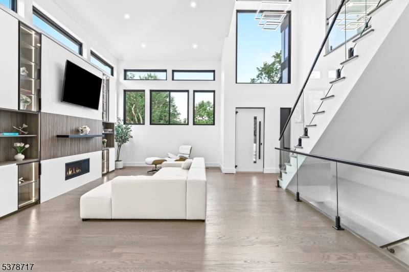 Ultra contemporary NEW CONSTRUCTION with 10 year warranty 6 bedroom, 5 bath home with a 2 car garage, a custom design build by Exodus Development.