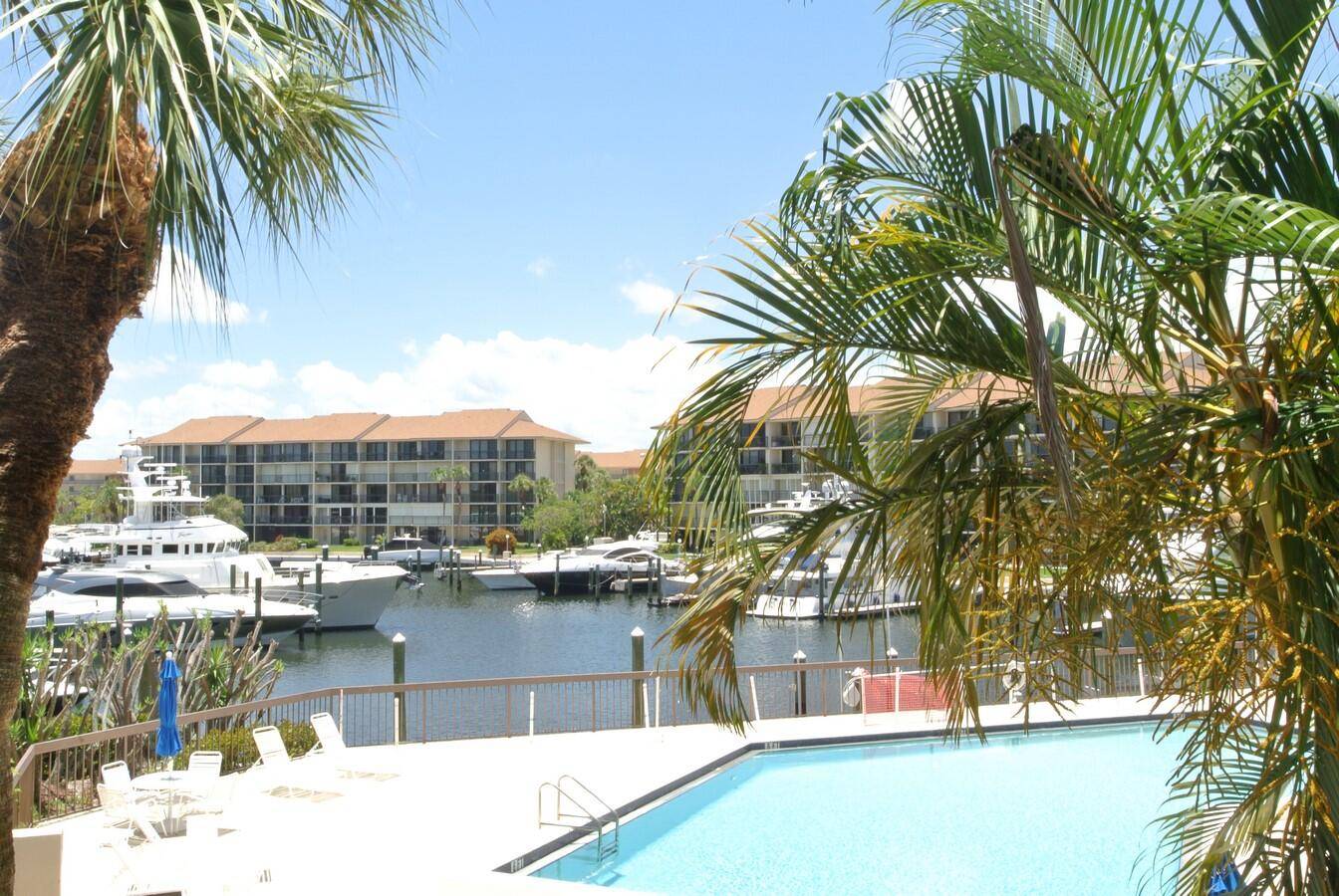 Beautifully updated and newly furnished waterfront condo featuring stunning pool and marina views.