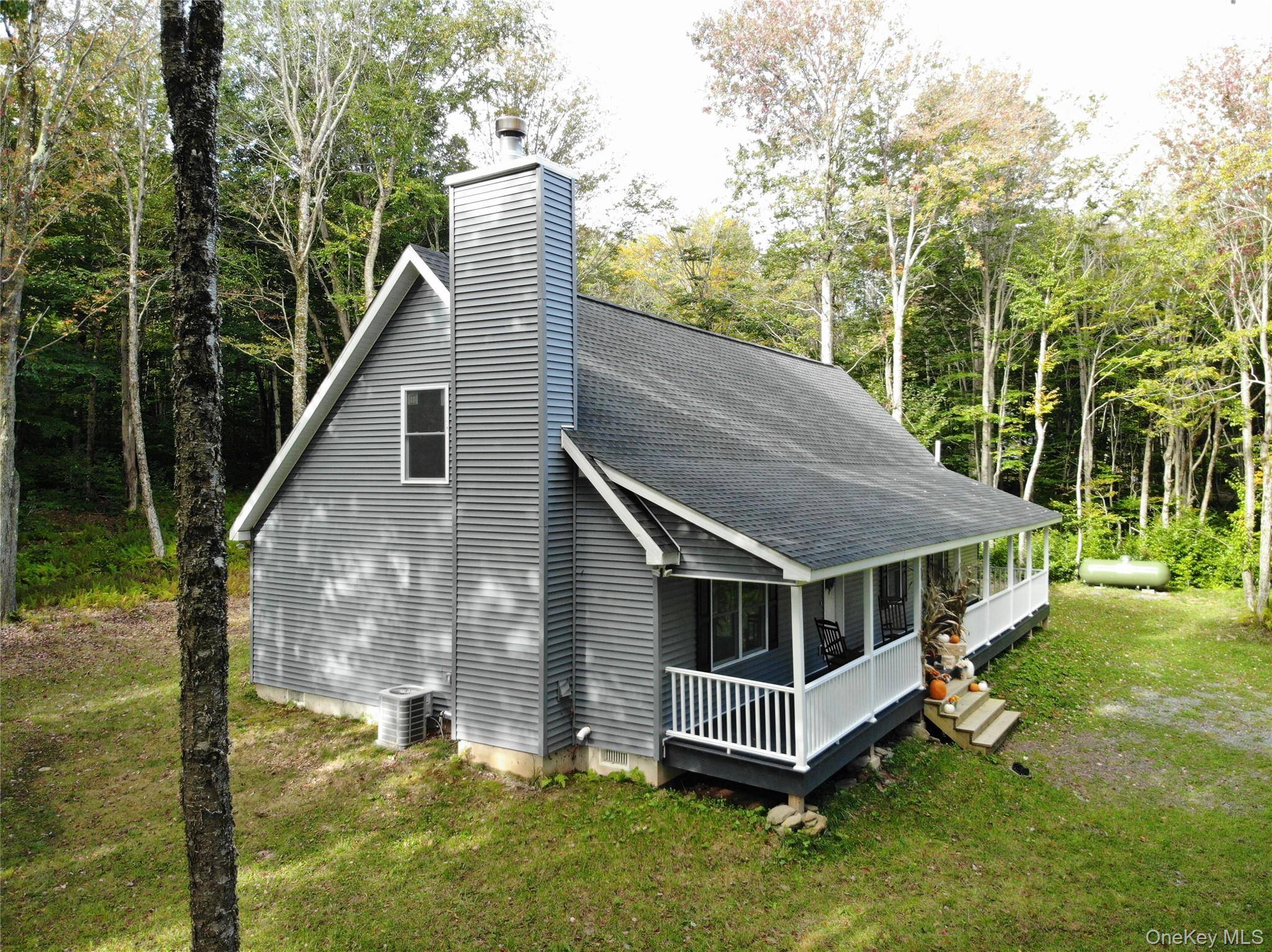 Privately tucked away on 57 wooded acres on top of a mountain in Livingston Manor, this home is a real treat.
