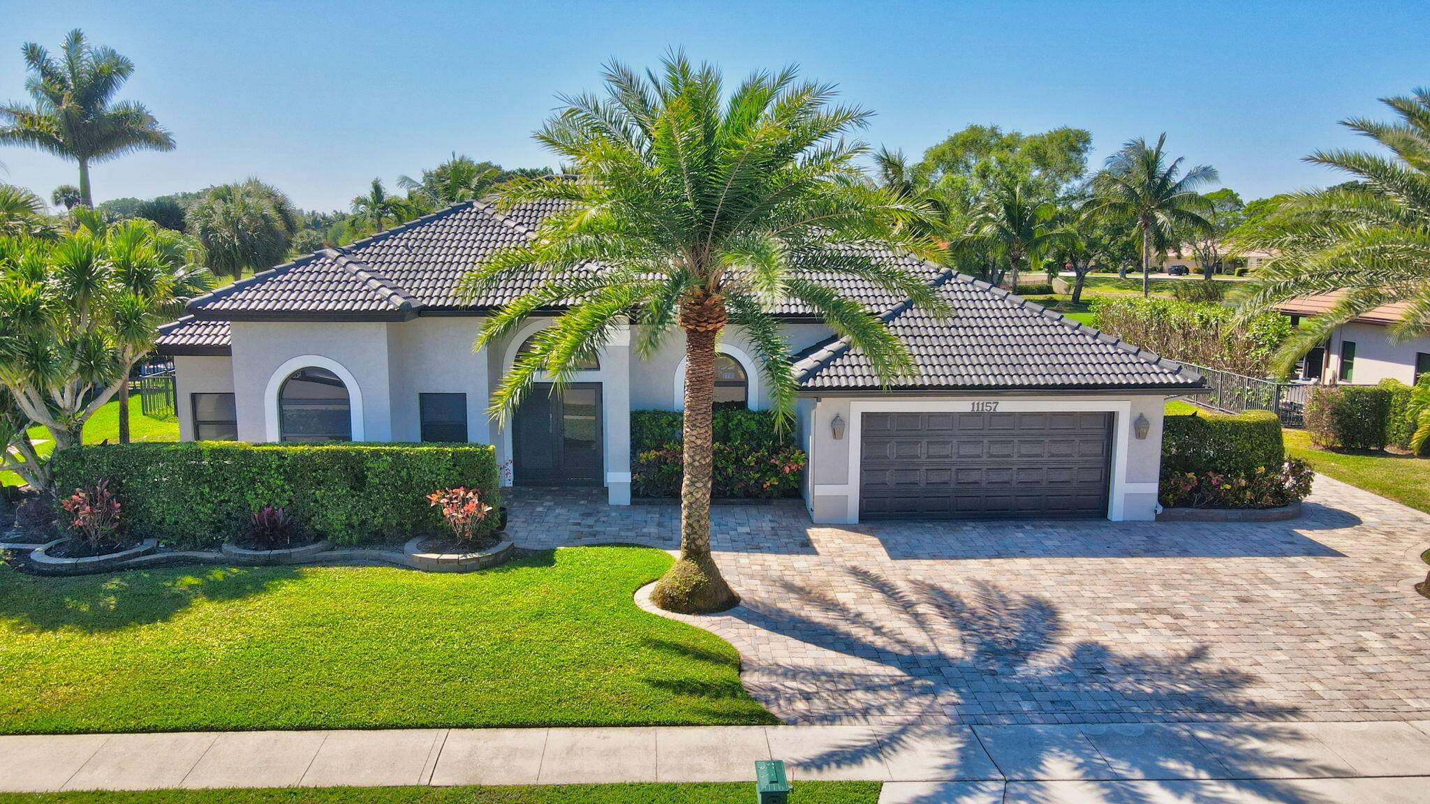 Nestled in the heart of Boca Woods Country Club, this home sits on an exceptional lot with sweeping golf course views and a bright, open layout.