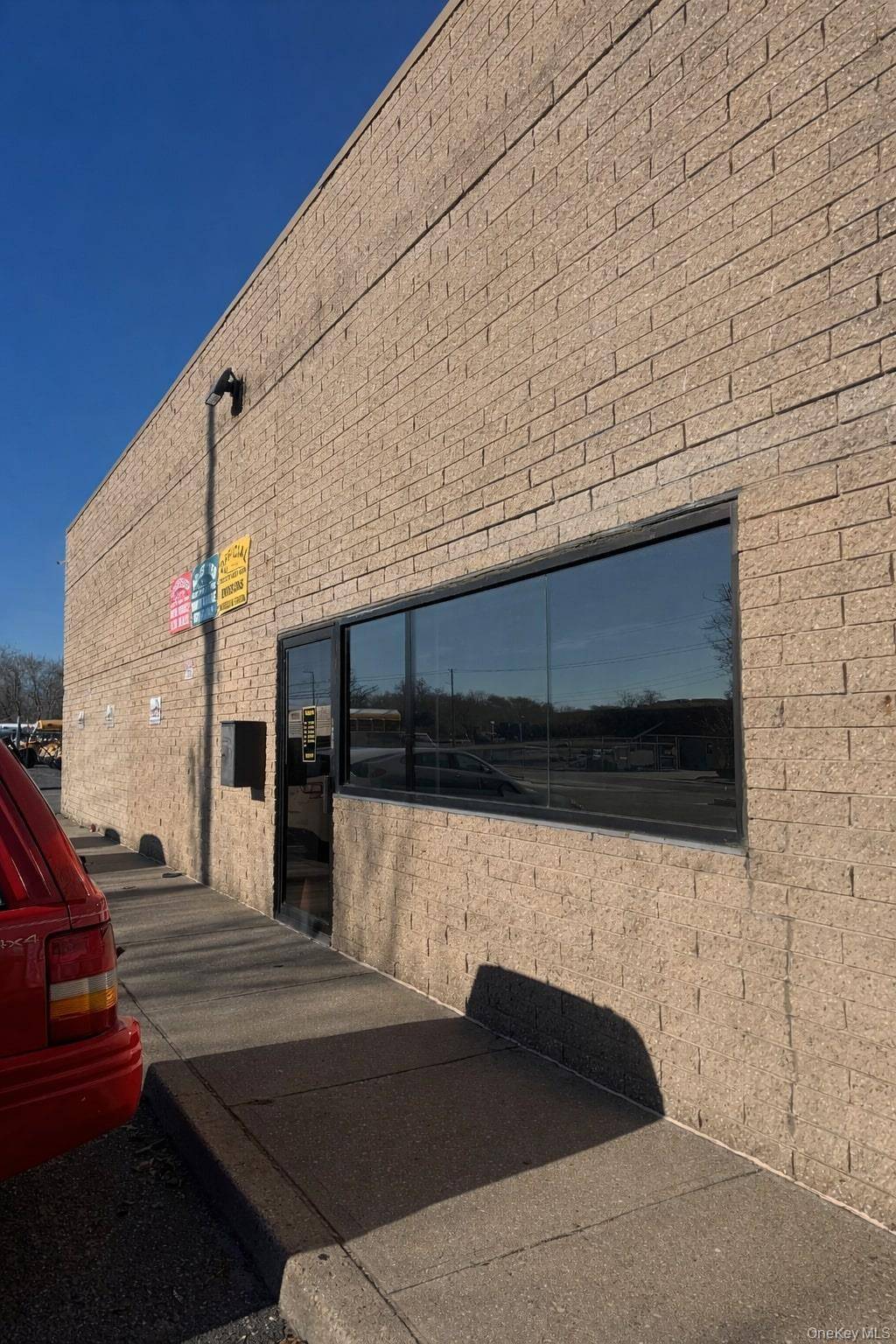 Versatile industrial property offering clear span warehouse space, high ceilings, and grade level drive in access.