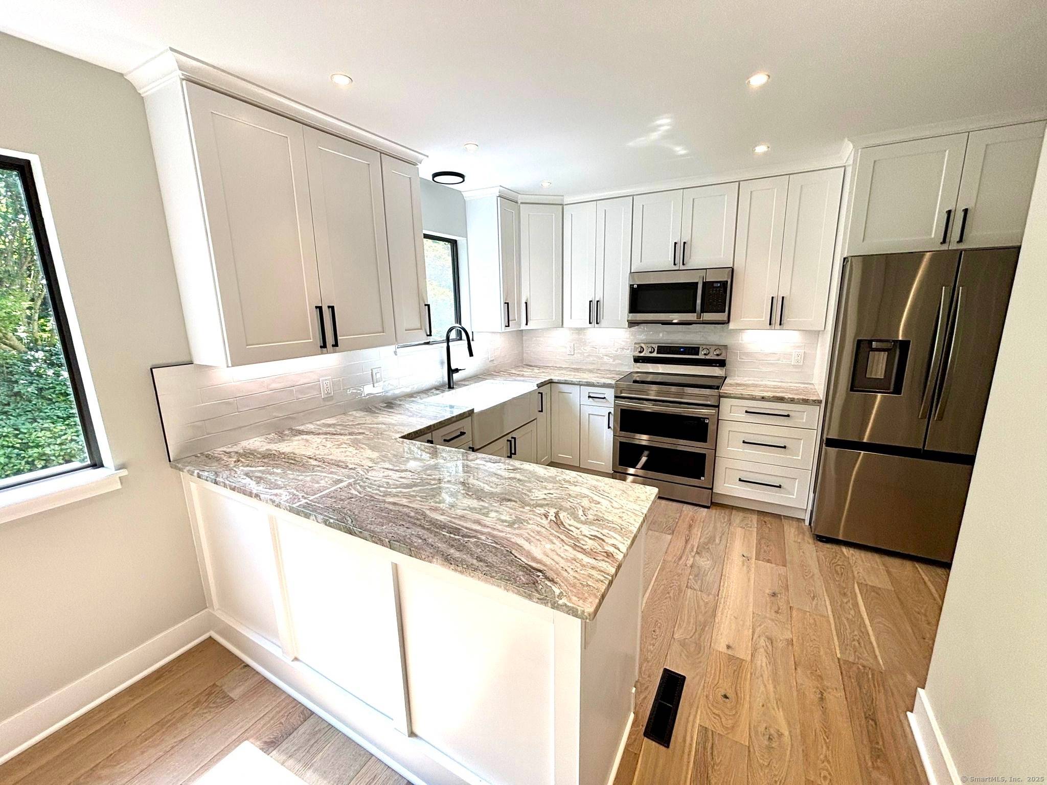 Spectacular renovation of this light and bright Sherman beautifully set on sought after Krueger Circle.