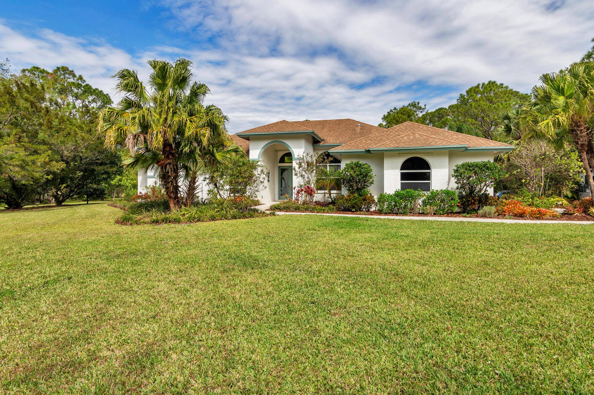 All sizes approximate. Nestled in a park like setting you will find this meticulously maintained CBS pool home !