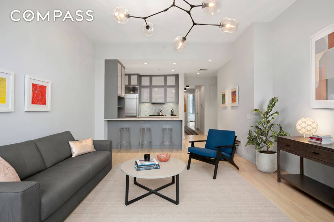 Start each day watching the sun rise over the Williamsburg Bridge from your spacious living room.