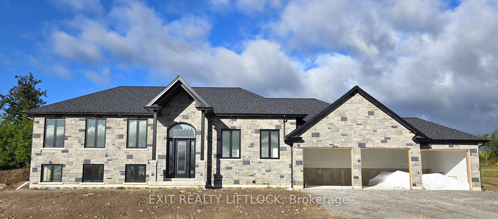 Currently Under Construction Custom built executive stone bungalow by Davenport Homes in the rolling hills of Cavan.