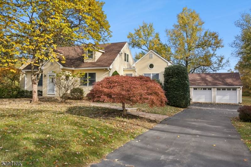 This expanded cape cod is the perfect home, located on 5 acres.