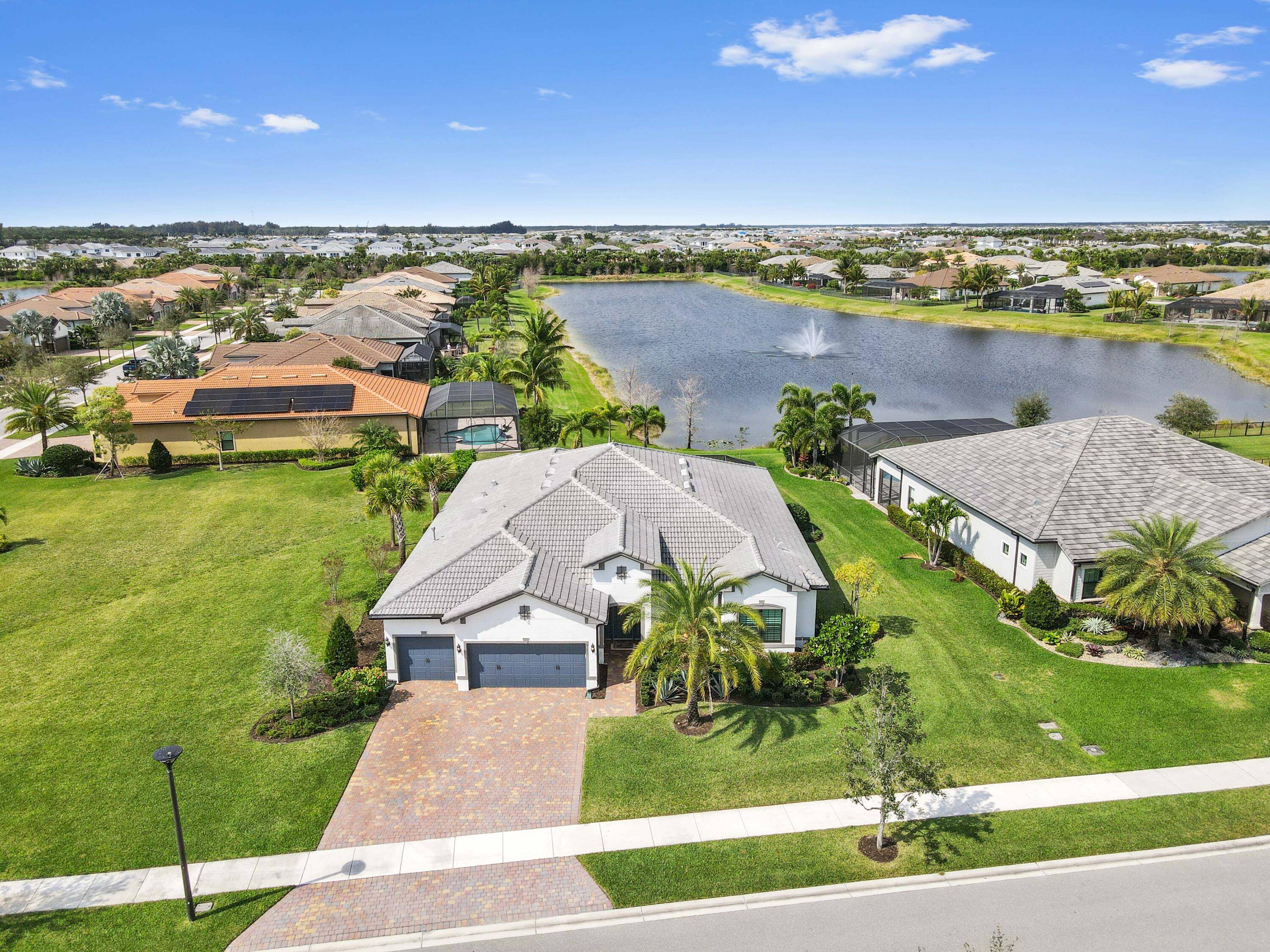 Experience unparalleled elegance in this stunning 2021 built waterfront home, perfectly situated on an oversized lot in the prestigious Ancient Tree community.