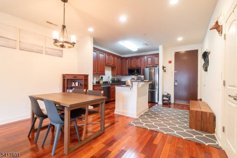 Rare duplex residence at Port Imperial offering a highly desirable two floor layout with a private balcony !