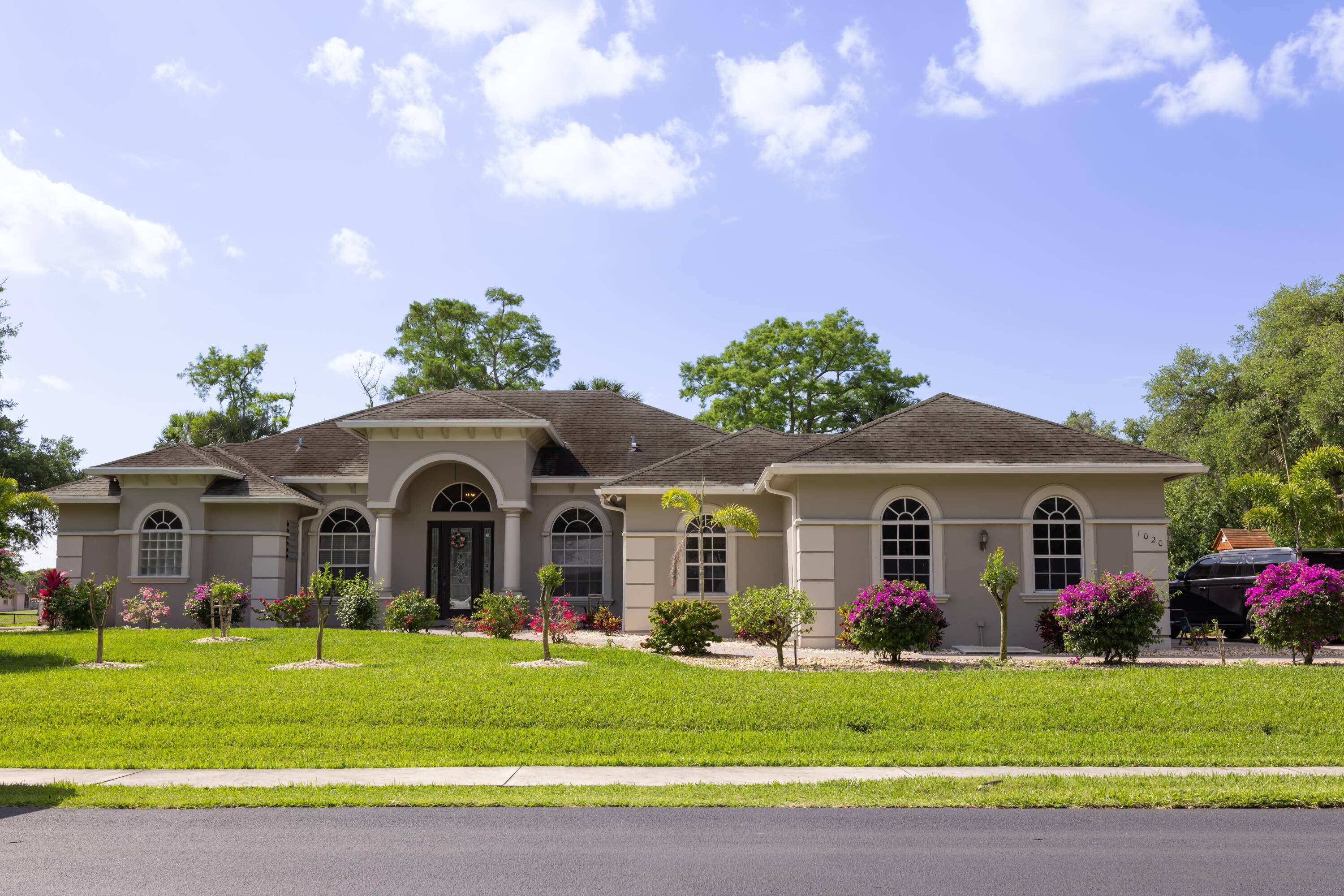 Nestled in a serene gated community, this stunning 4 bedroom, 3 bathroom home offers 2, 800 sq.