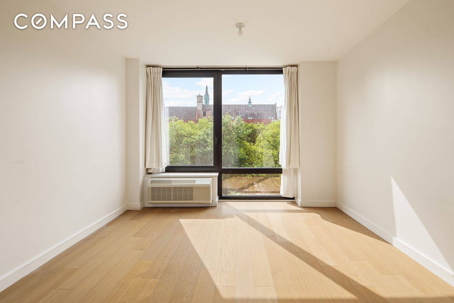 Serene and tranquil studio with excellent daylight from unobstructed views of the park.