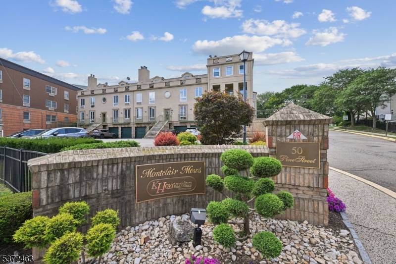 Experience the rare privacy of a dual level layout at Montclair Mews with a highly coveted garage.