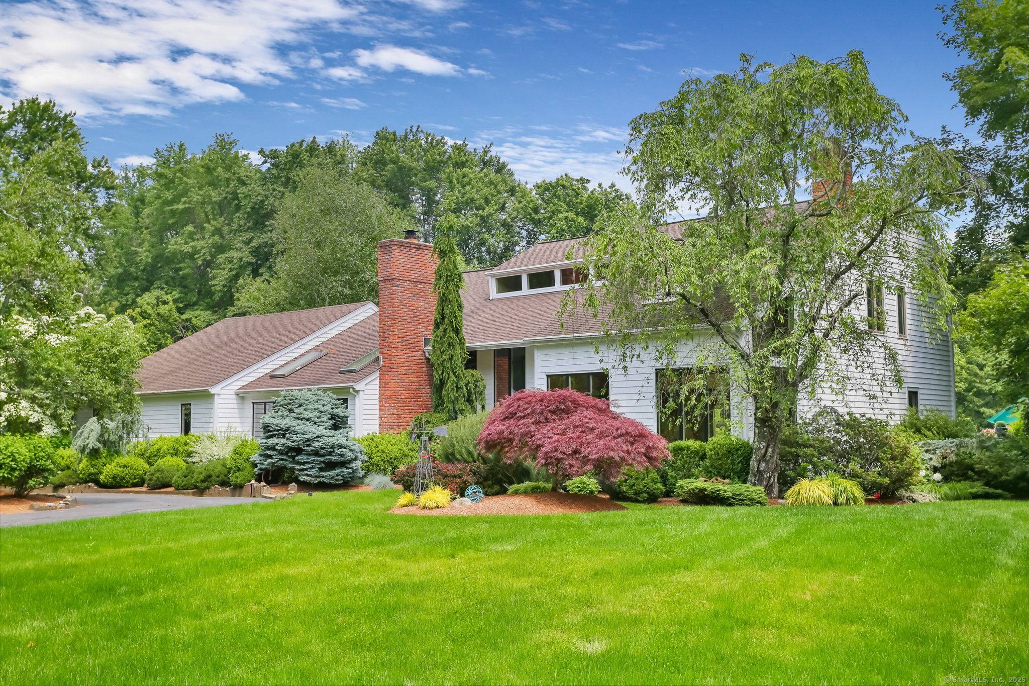Tucked on a peaceful cul de sac in prime lower Weston, this contemporary gem is a rare find.
