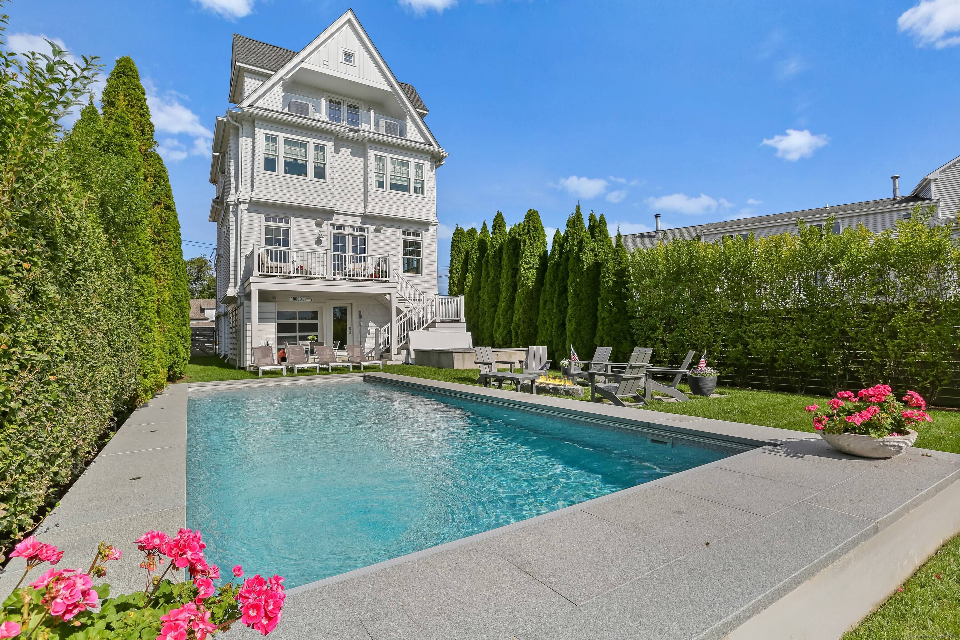 Enjoy life just 44 steps from your own private beach path in this completely renovated coastal home, where every detail has been designed for year round enjoyment.