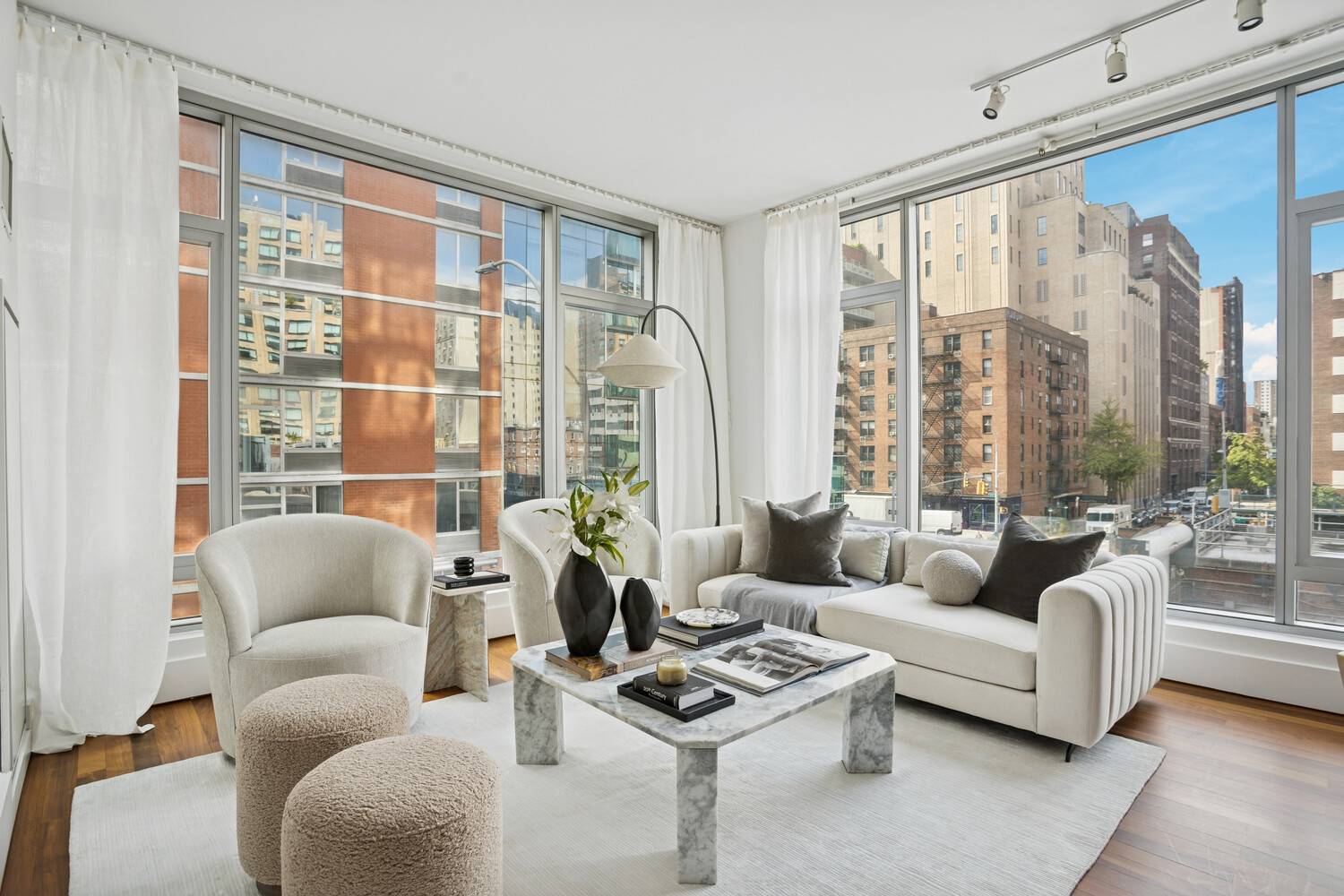 This exceptional two bedroom, two bathroom residence features a welcoming entry foyer that opens to an expansive corner living room framed by a dramatic wall of windows that flood the ...