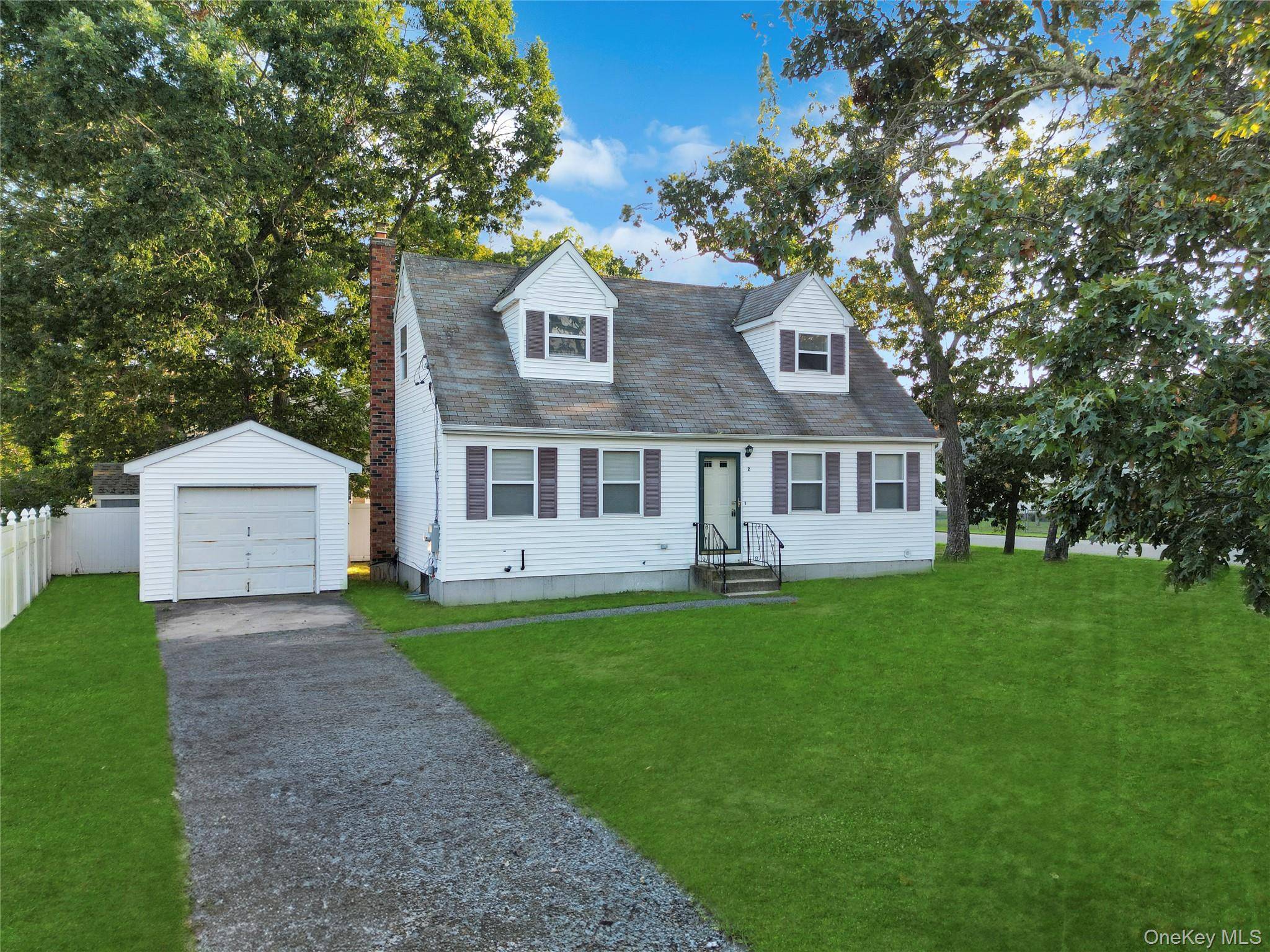 Charming Four Bedroom Cape with Modern Amenities Welcome to your dream home !