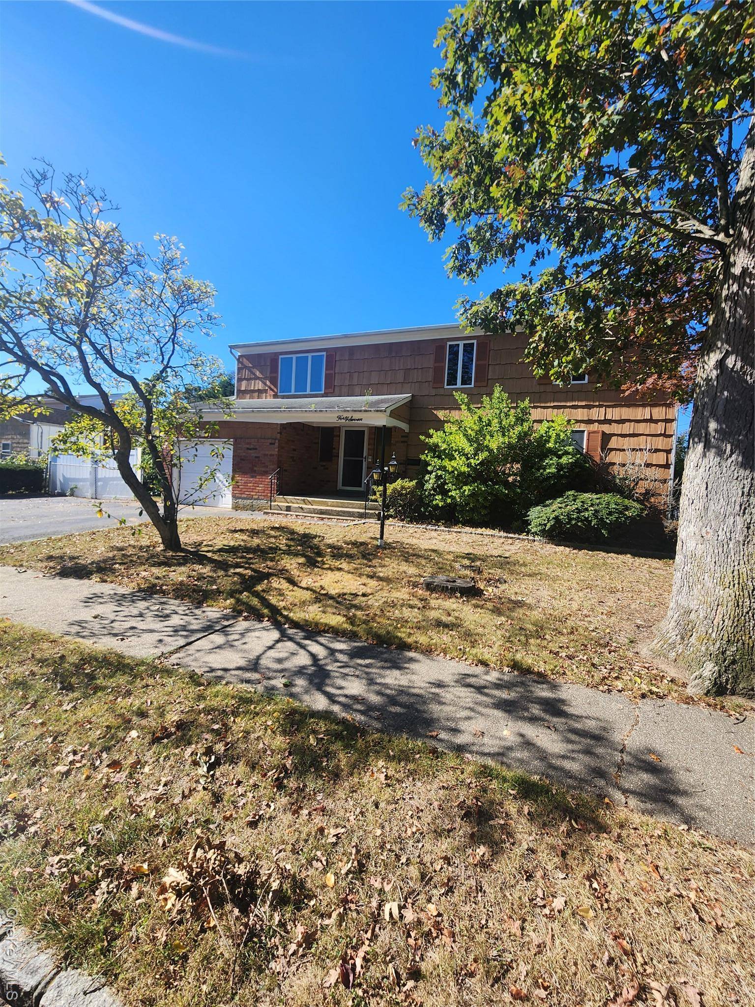 Custom 5 bedroom Colonial PLUS one car garage, driveway parking for 3 cars, basement with outside entrance cornering property with vinyl fencing.